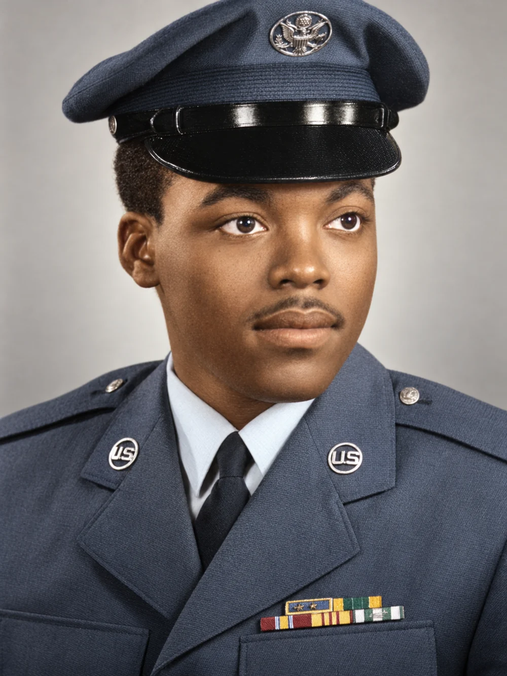 Larry Thomas Brown as a young airman in United States Air Force dress uniform and service cap